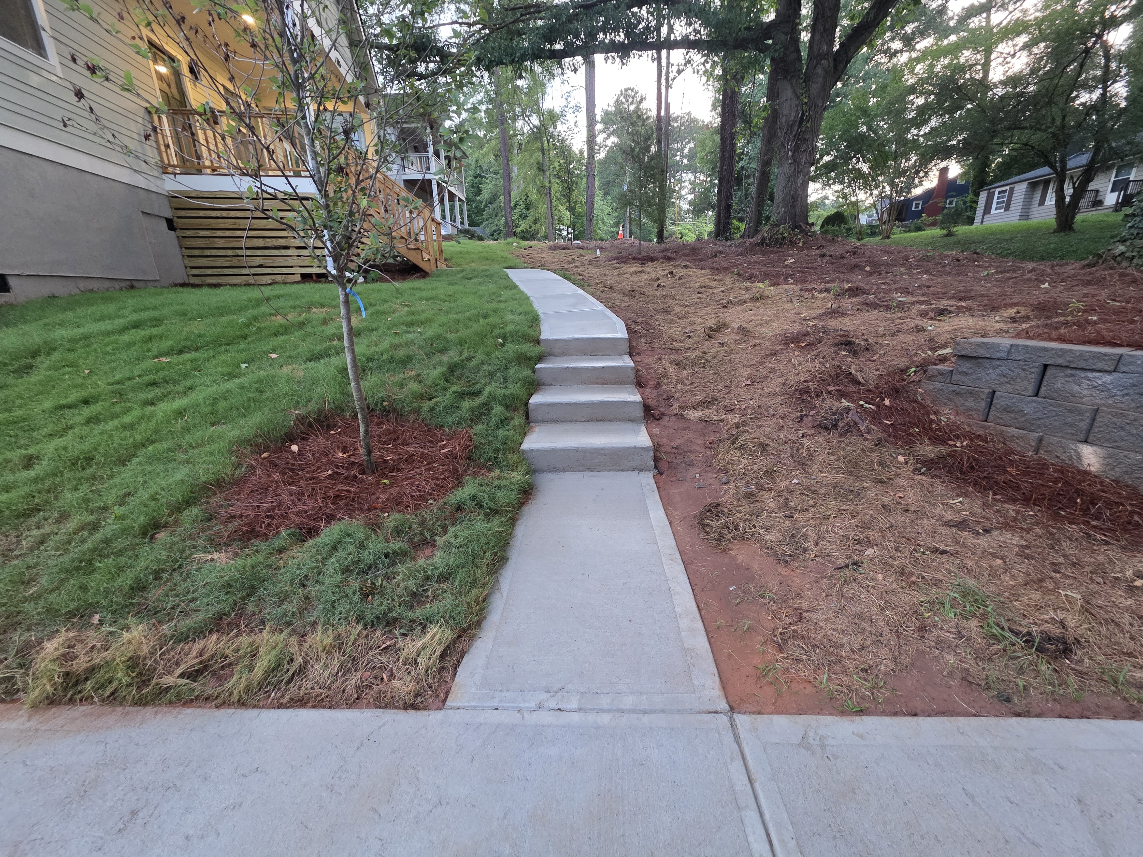 Concrete walkway with steps at a new construction home after pressure washing in Atlanta, GA.